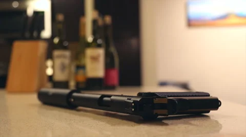 Suppressoded Pistol Picked Up Stock Footage 68365677
