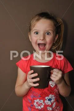 Suprised girl with brown cup Stock Photos