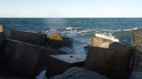 Surf and Rainbow at the Breakwater Stock Footage 49744111