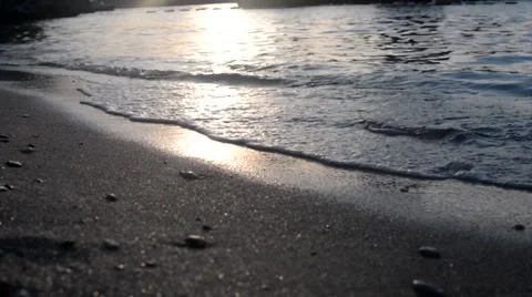 Surf and sunset on the beach Stock Footage 68768461