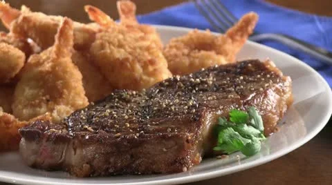 Surf and Turf (grilled beef steak and prawns) Stock Footage 24669585