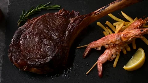  surf and turf, tomahawk steak and shrimps Stock Footage 269559782