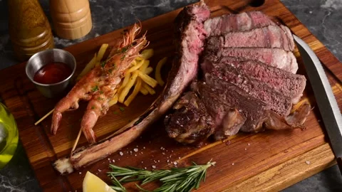 Surf and turf, tomahawk steak and shrimps Stock Footage 269560106