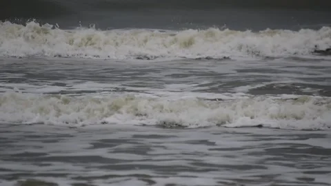 Surf on a beach of the North Sea on a cloudy day Stock Footage 154749038