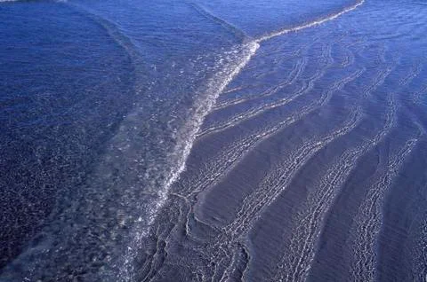 Surf on a Beach Stock Photos