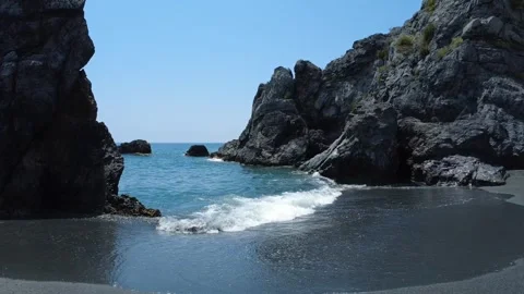 The surf between the rocks Stock Footage 324858278