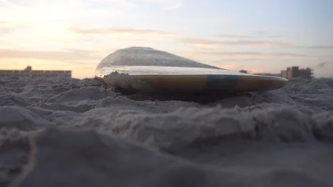 Surf board in sand with sunset Stock Footage 98909655