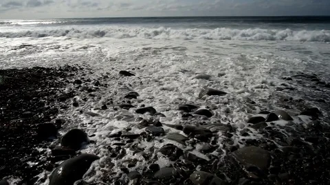 Surf Closing In on a Pebbly Beach Stock Footage 80272109