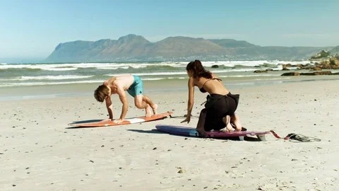 Surf coach demonstrating surfing actions Stock Footage 76522000