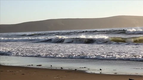 Surf crashing on an empty beach. Stock Footage 88342829