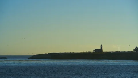 Surf icon Lighthouse point silhouetted at Santa Cruz at Sunset Stock Footage 95610038