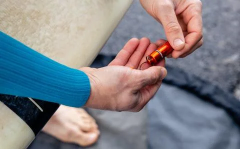 Surf prep - earplug fitting. Stock Photos