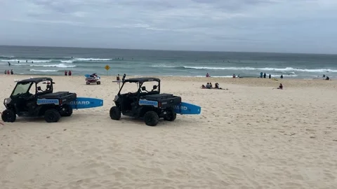 Surf rescue Bondi beach buggy vehicle with surfboard on Side Stock Footage 219666115