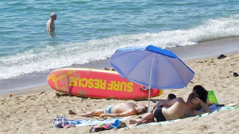 Surf Rescue Table at the Beach surrounded by people sunbathing Video stock 135799793