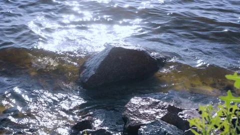 Surf on the rocky beach Stock Footage 90913894