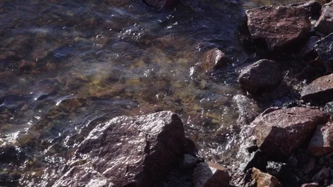 Surf on the rocky beach Stock Footage 90913923