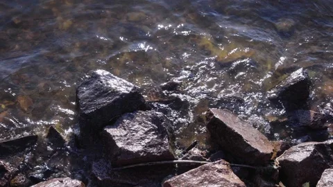 Surf on the rocky beach Stock Footage 90913924