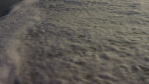 Surf on a sandy beach at sunset Stock Footage 311865585