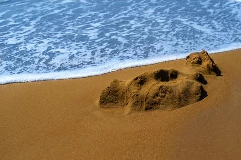 Surf on the sandy coast Foto stock