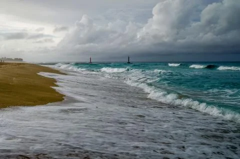 In the surf, on the shore of the ocean Stock Photos