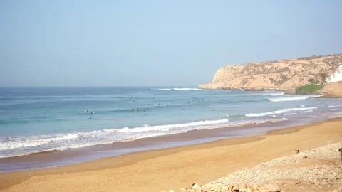 Surf spot anchor point full of beginner surfers on a sunny day Stock Footage 296689156