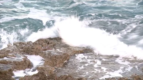 Surf on stone beach with foam in summer large 스톡 동영상 84316333