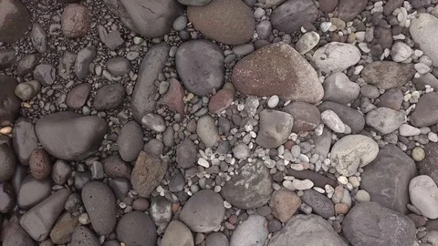 Surf on a stone beach Stock Footage 106881389