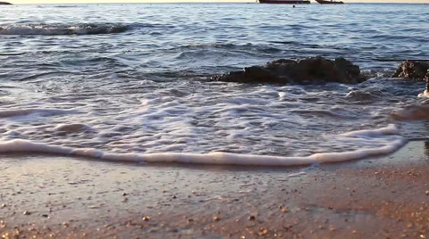 Surf at sunrise on an empty beach Stock Footage 60751065