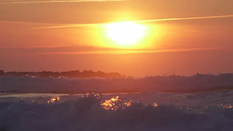 Surf Sunset in wild ocean, Big sun sunset, red sky in Basque Country Video stock 152636006
