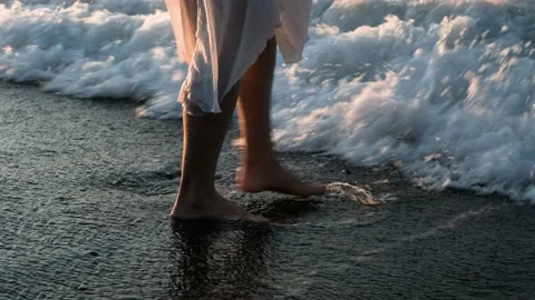 The surf washes the woman's feet. Stock Footage 159968643