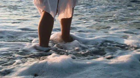 The surf washes the woman's feet. Stock Footage 164531753