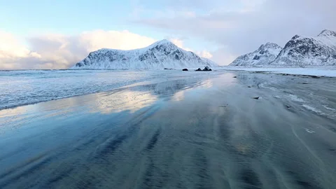Surf Wave on the Norwegian Winter Beach between the Mountains Stock Footage 106464566