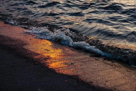 Surf waves and sun reflection in the port of Nida. Lithuania Stock Photos