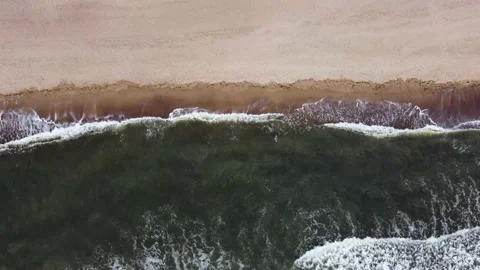 Surf of the waves of the black sea. Wild beach. aerial Stock Footage 234422964