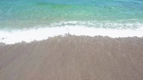 Surf waves on pebble beach Stock-Footage 313891690