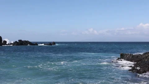 Surf waves rolling over a reef with white water break. 4K. Stock Footage 201131057