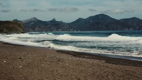 Surf on a wild beach Video stock 72774998