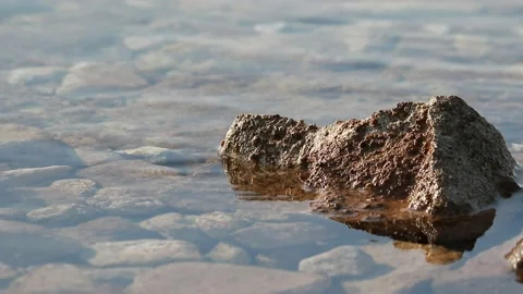 Surface of the Adriatic Sea with small waves and stones Stock Footage 131611519