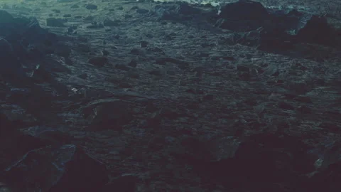 Surface of an alien planet with rocky terrain and low light conditions Stock Footage 343575438