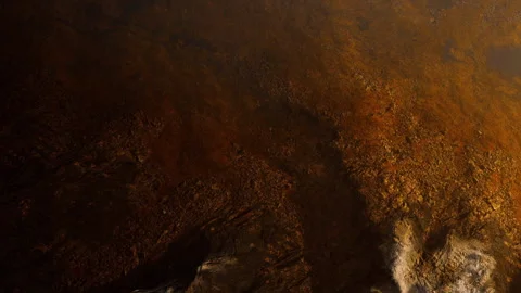 Surface of an alien planet with rust colored terrain and uneven features Stock Footage 345014057