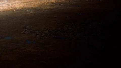 Surface of an alien planet shows rocks and dust with shadows and light Stock Footage 341012425