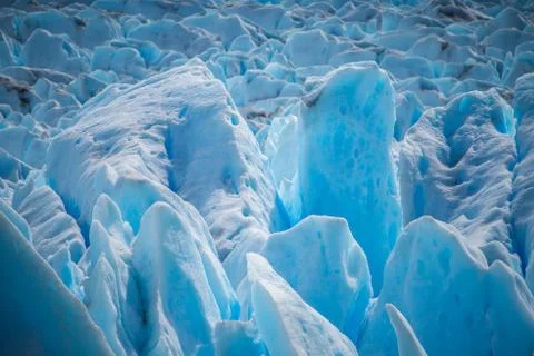 The surface of the blue glacier in daylight. Shevelev. Stock Photos