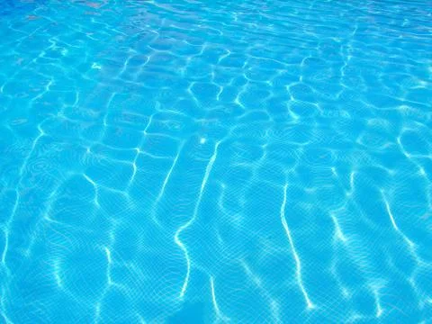 Surface of blue swimming pool, Background of water in swimming pool. Stock Photos