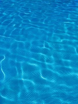 Surface of blue swimming pool, Background of water in swimming pool. Stock Photos