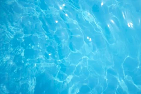 Surface of blue swimming pool. Background of water in swimming pool Stock Photos