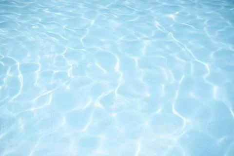 Surface of blue swimming pool, background of water in swimming pool. Stock Photos