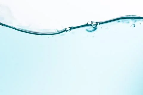 Surface of the blue water waves splash on a white background Stock Photos