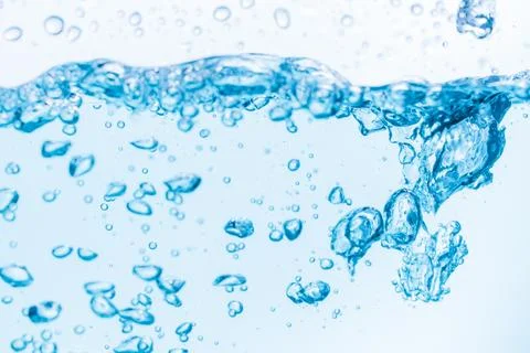 Surface of the blue water waves splash on a white background Stock-Fotos