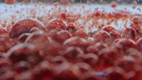 Surface with blurred red drops on which other drops are dripping Stock Footage 132188448