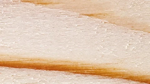 Surface of board moving sideways, close-up macro 動画素材 255034090